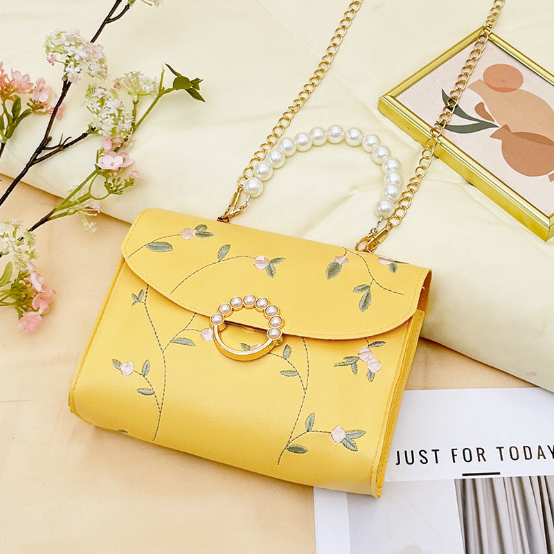 Wholesale bag with embroidered pearls and magnetic buckle chain